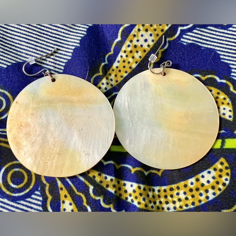 Large, shimmery, mother-of-pearl-looking earrings